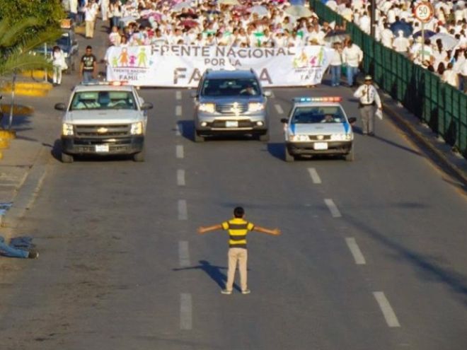 Twelve year old blocks a homophobic march in Guanajuato.